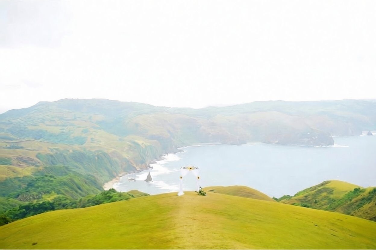 Marlboro Hills Rakuh a Payaman Batanes rolling green hills meeting the Pacific Ocean coastline