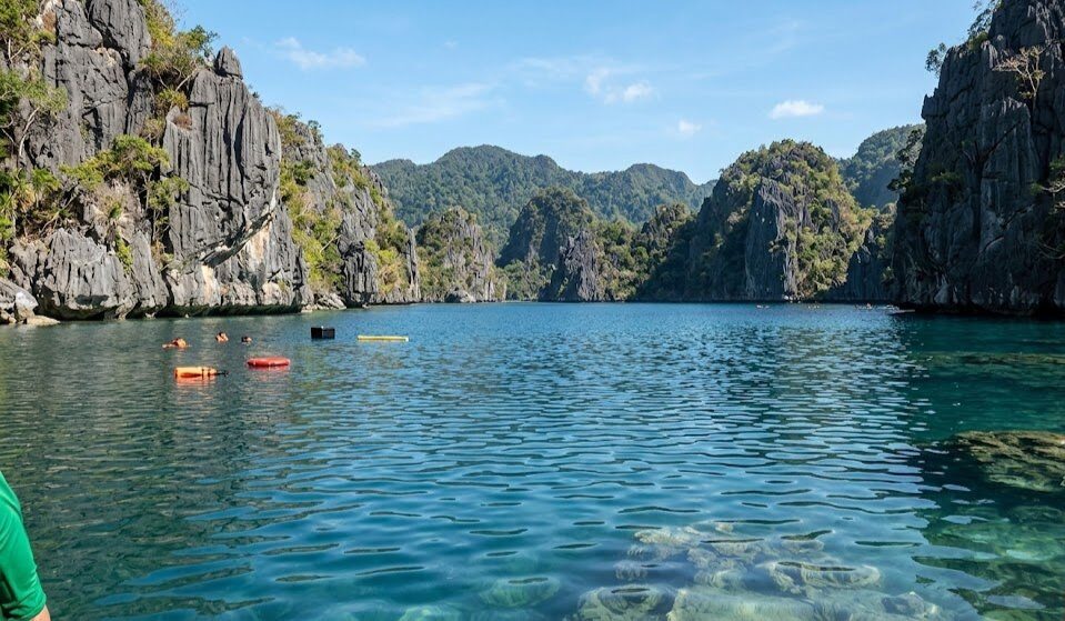 Barracuda Lake Coron clear blue water surrounded by dramatic vertical limestone karst formations