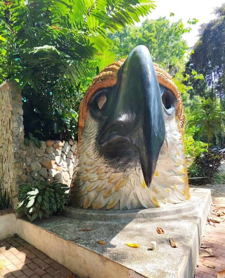 Philippine Eagle Center Davao giant eagle head sculpture at the entrance garden in Calinan